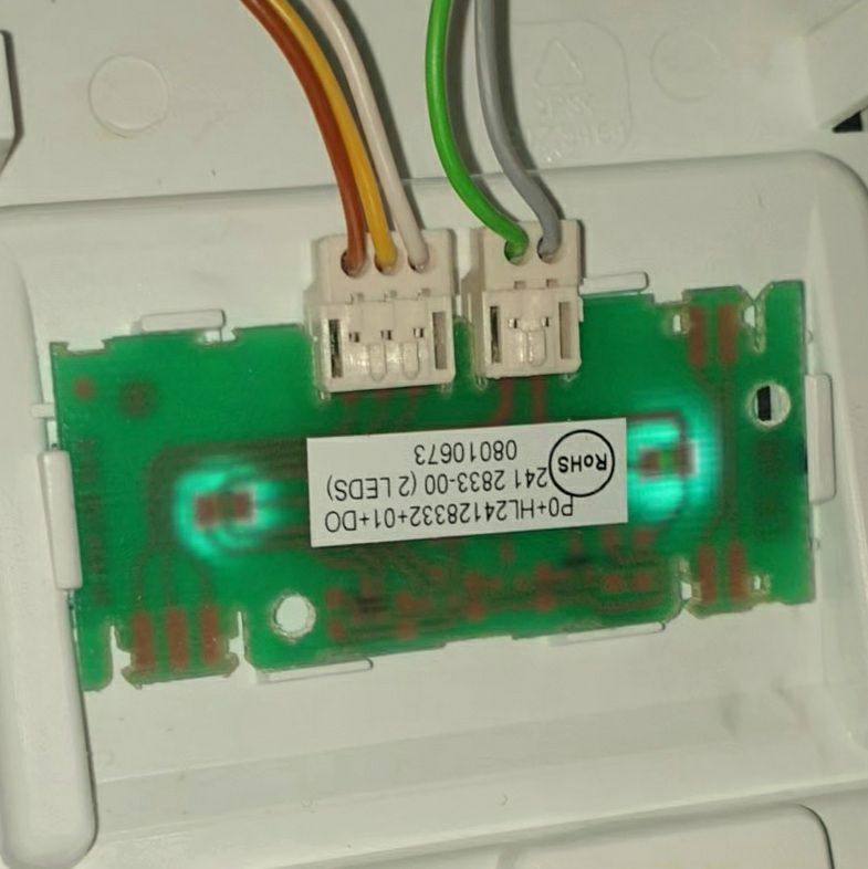 Single-layer mini-fridge light PCB held in its plastic enclosure without screws